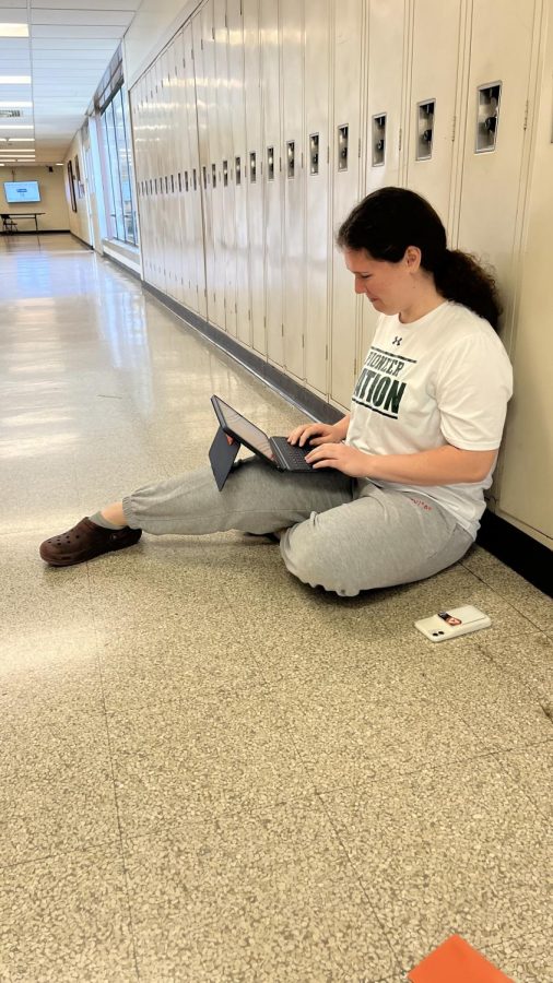 This shows a student being productive, and getting her work down on her iPad.