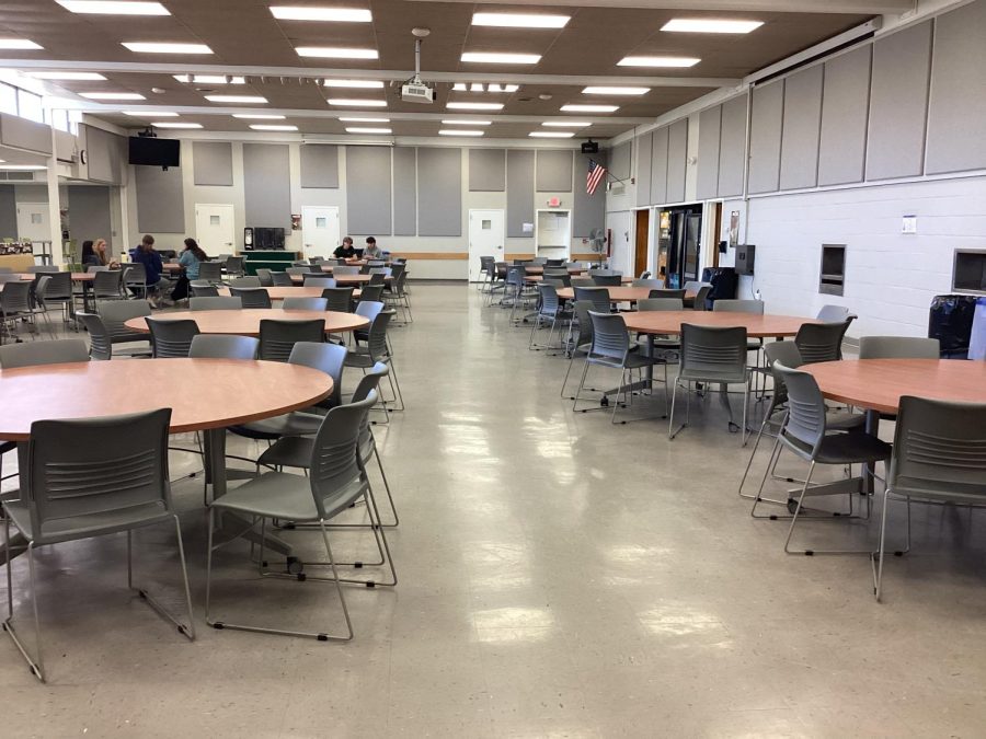 Before lunch, very few students are in the cafeteria. 