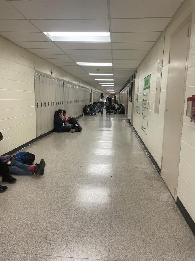 The hallways slowly start to fill up with more students. 