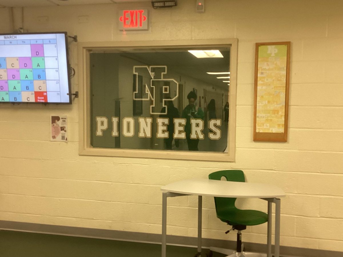 NP pioneers sign in the middle of the hallways.