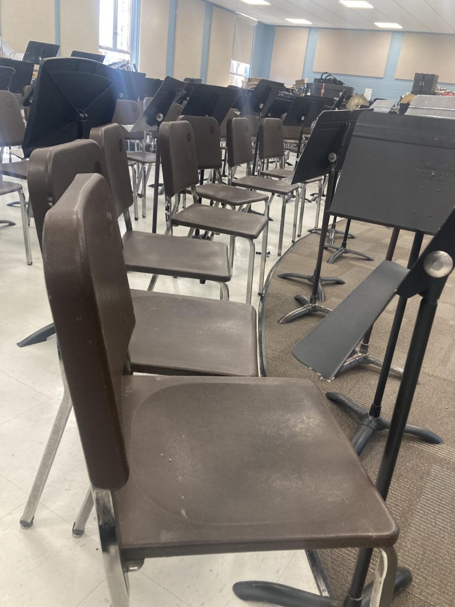 Rows of chairs and music stands in the band room.