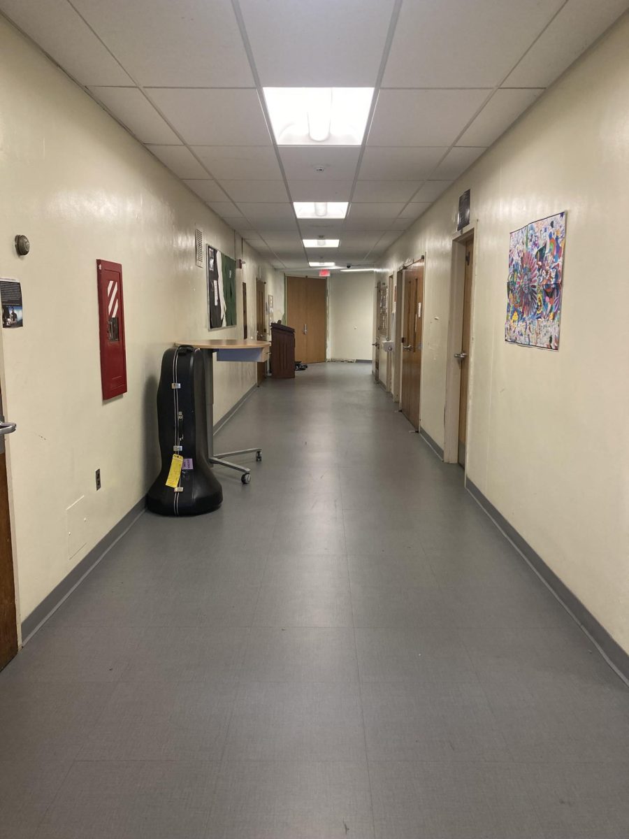 Music wing hallway, featuring the doors to the band room, the cage, Mr. N and Mrs. Spina’s office, and an entrance to the auditorium.