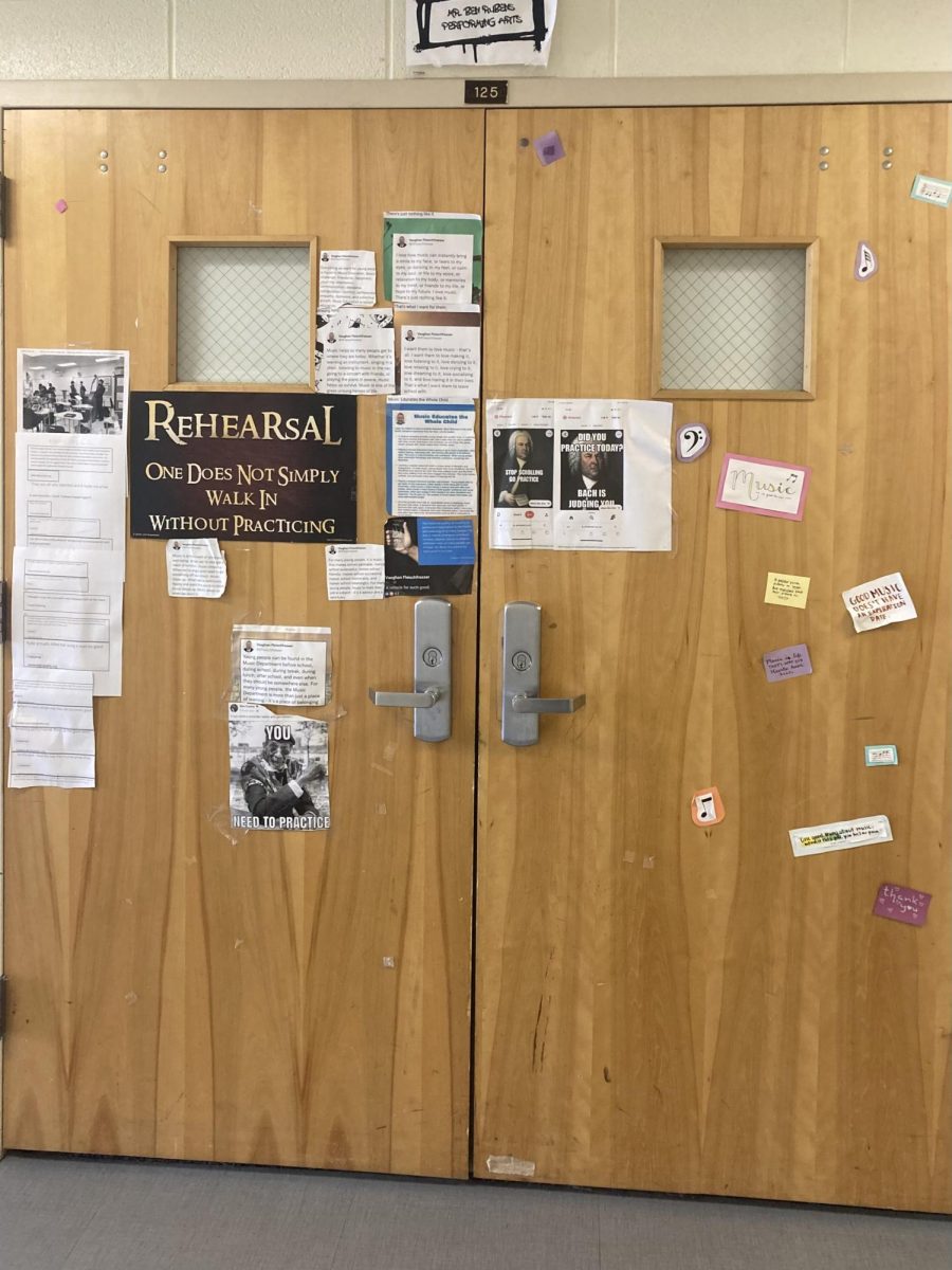 Door to the orchestra room, featuring many musical posters and inspirational quotes.
