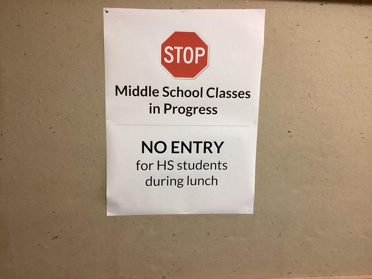 Stop signs that says high schoolers can’t enter area due to middle school classes