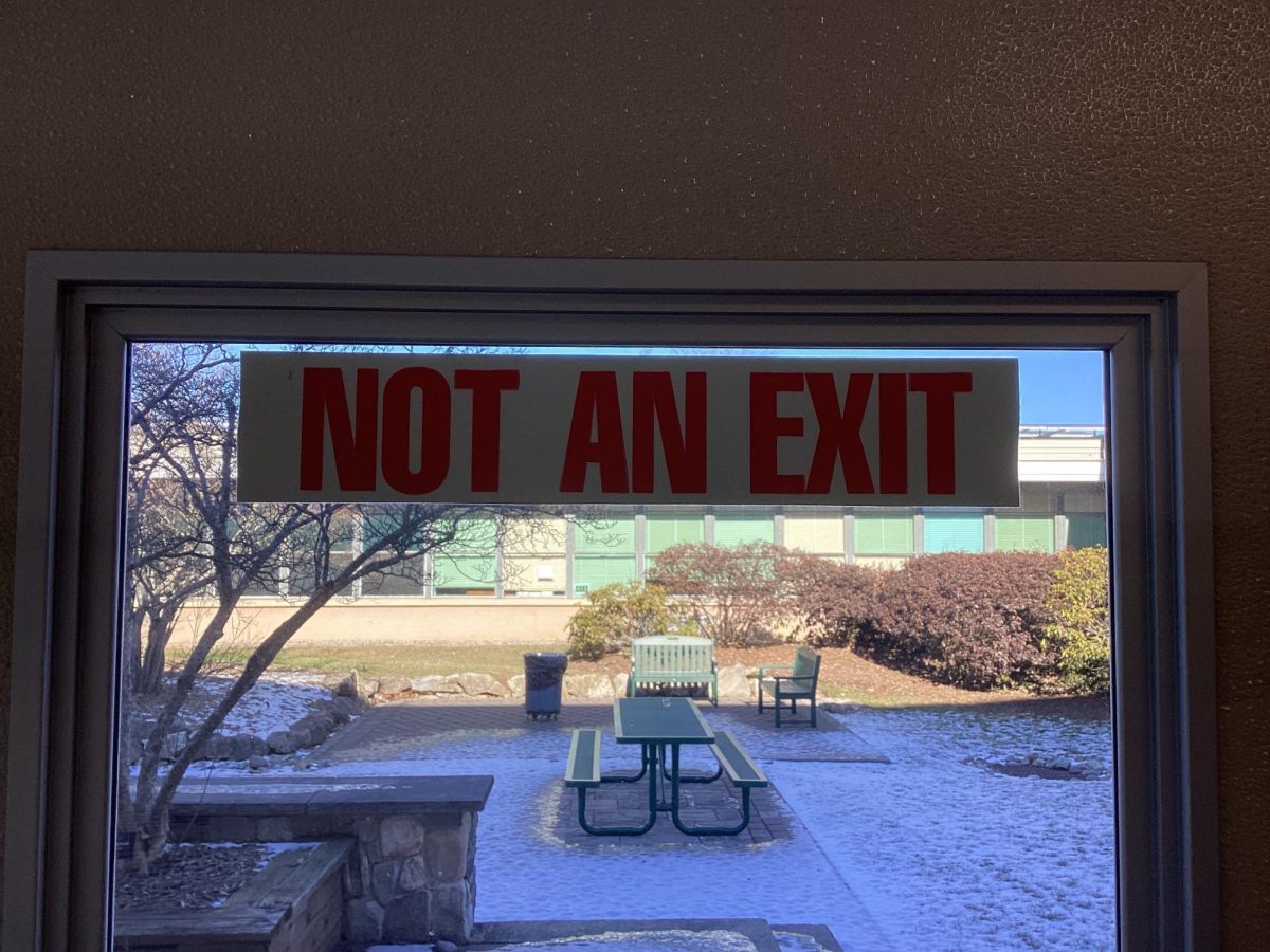 Sign saying door is not an exit