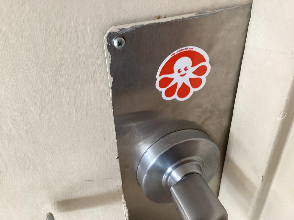 Sticker on drama room door handle 