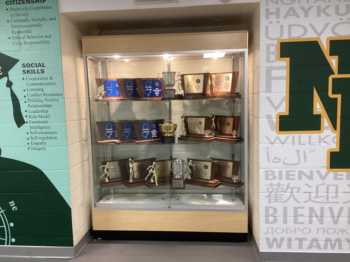NPHS varsity girls basketball, cross country, and tennis trophy case
